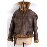 A SECOND WORLD WAR BRITISH IRVIN LEATHER FLYING JACKET unlabelled, with a pale brown sheepskin