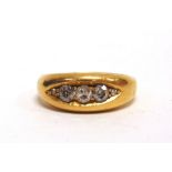 A FIVE STONE DIAMOND 18 CARAT GOLD RING Birmingham 1908, the three old cut brilliants, totalling