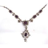 AN EDWARDIAN PASTE NECKLACE the amethyst and colourless pastes arranged as clusters alternating with