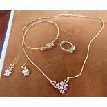 A SUITE OF DIAMOND AND RUBY SET 9 CARAT GOLD JEWELLERY also stamped '375', comprising: a necklace; a