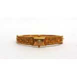 A 9 CARAT GOLD DIAMOND SET HINGED BANGLE Birmingham 1909, the star set old brilliant cut of