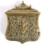19TH CENTURY - A BALKAN BRASS REPOUSSE CARTRIDGE BOX  decorated with figures, trophy of arms, and