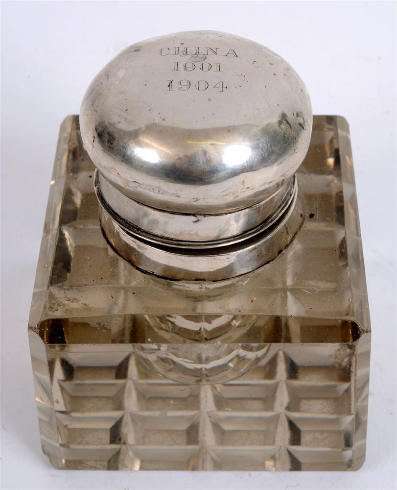 19TH CENTURY - CHINA BOXER REBELLION - A LARGE HEAVY CUT-GLASS INKWELL  the silver top inscribed '