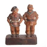 SECOND WORLD WAR - A GERMAN PRISONER OF WAR CARVED WOODEN FIGURAL GROUP  comprising stylized British