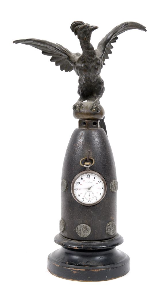 19TH CENTURY - A FINE FRANCO-PRUSSIAN WAR CONICAL IRON PROJECTILE WATCH STAND  with lead inlaid