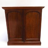 A MAHOGANY COIN CABINET containing fourteen double-pierced trays, various size apertures, with