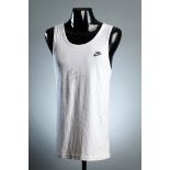 A Michael Johnson signed white Nike running vest, signed across the chest in black marker pen