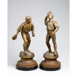 A pair of French 19th century spelter figures with the unusual sporting subject of jeu de balle au