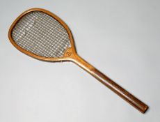 A racquet with slightly tilted head circa mid-1880s, with heavy strings (some breaks), primitive