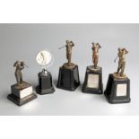 A group of five golf trophies, including three set with plaques inscribed for the Maw Trophy with