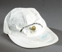 A Seoul 1988 Olympic Games souvenir cap signed by the gold medallists Carl Lewis and Joe DeLoach,