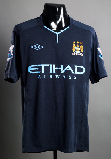 Patrick Vieira: a dark blue Manchester City No.24 away jersey, short-sleeved, Premier League badges,