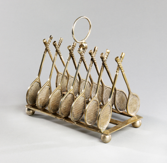 An electroplated toast rack with dividers designed as tennis racquets circa 1900, 14 racquets in