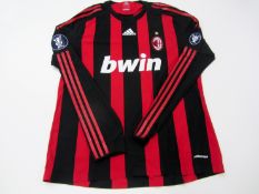 Andriy Shevchenko: a signed red & black striped AC Milan No.76 jersey season 2008-09, signed on