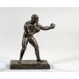 A bronze figure of a boxer, rich brown patina, mounted on a marble base 21.5cm., 8 1/2in. high,