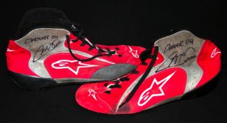 Colin McRae DAKAR 04 signed used driving boots, both signed in marker pen on the grey and red