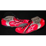 Colin McRae DAKAR 04 signed used driving boots, both signed in marker pen on the grey and red