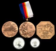 A group of three cased medals relating to the Seoul 1988 Olympic Games, i) a prize medal in