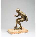 A metalware figure of a roller skater, gilded patina, Italian by Tuttobocce, on marble plinth, 27 by