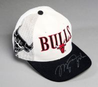 A Chicago Bulls cap signed by Michael Jordan,