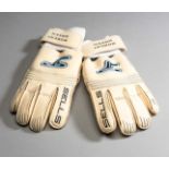 A pair of Robert Green goalkeeping gloves,
white Wrap Series AQUAsTem gloves by Sells,