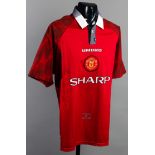 A Manchester United replica jersey signed by the 1999 Champions League Final goalscorers Teddy