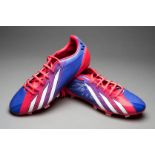 A Lionel Messi signed pair of football boots,
