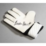 A goalkeeper's glove signed by Gordon Banks,
black & white Umbro,