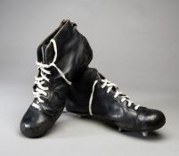 A pair of vintage rugby boots,
large, size 11, black leather, white lacing,