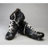 A pair of vintage rugby boots,
large, size 11, black leather, white lacing,