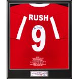 A signed Ian Rush Liverpool tribute shirt, reverse mounted, signed in black marker pen on the No.