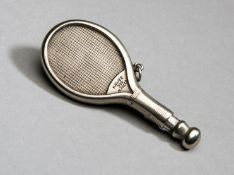 A Continental metalware matchstick striker in the form of a very detailed miniature tennis racket,