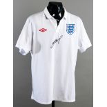 A white England replica jersey signed by the former captain Steven Gerrard,