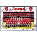 A signed photograph of the Arsenal squad season 2010-11,
8 by 12in.