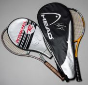 Two tennis racquets with the head covers signed by the champions players Andre Agassi and Mats