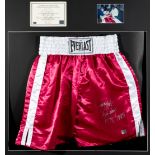 A Larry Holmes signed pair of boxing trunks,