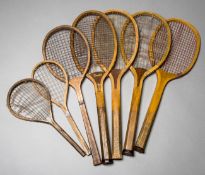 A group of seven vintage tennis racquets,