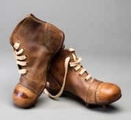 A pair of vintage child's football boots,
child's size 12, tan leather,