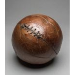 An antique Victorian leather football,
an eight panel leather ball with leather lacing,
