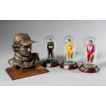 Ayrton Senna limited edition bronze by Vincent Hirst and three ceramic figurines by Sean Mills,