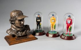 Ayrton Senna limited edition bronze by Vincent Hirst and three ceramic figurines by Sean Mills,