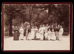 A French family group holiday photograph taken on a tennis court at Vernet-les-Bains in August 1892,