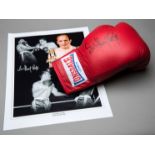 A Sir Henry Cooper signed boxing glove,