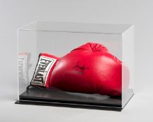 A Muhammad Ali signed boxing glove,