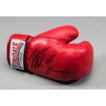 A Mike Tyson signed boxing glove,