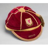 A red Wales international cap awarded to Gary Sprake in season 1973-74,