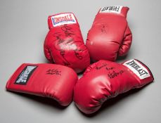 Four signed boxing gloves,
i) Larry Holmes, red right-hand Everlast 
ii) Nigel Benn,