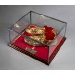 A pair of gold ceramic football boots cast from original George Best match-worn boots,
No.