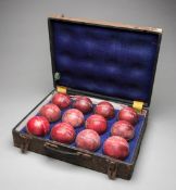 A collection of a dozen match-used cricket balls collected by the New Zealand umpire Melville