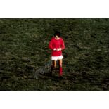 A collection of four George Best-signed colour photographic prints,